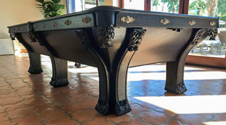 Beautiful, dark stained antique restored Pfister billiard table.