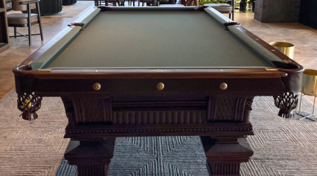 A beautifully restored antique "The Jewel" billiard/pool table