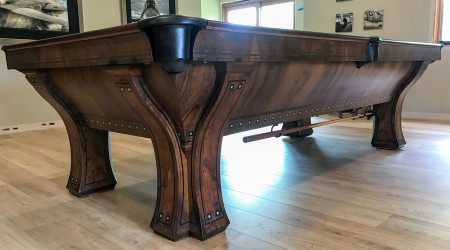 The side of a fully restored The Marquette billiard table from Billiard Restoration
