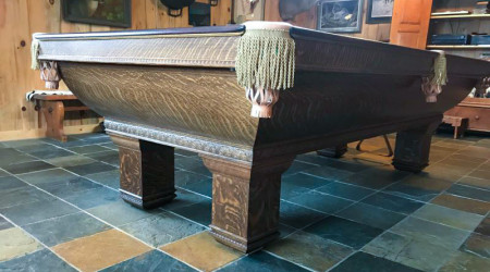 The corner pocket of a restored antique Saratoga billiard table