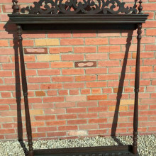 A beautiful 1850s cue rack that holds up to 14 pool cues